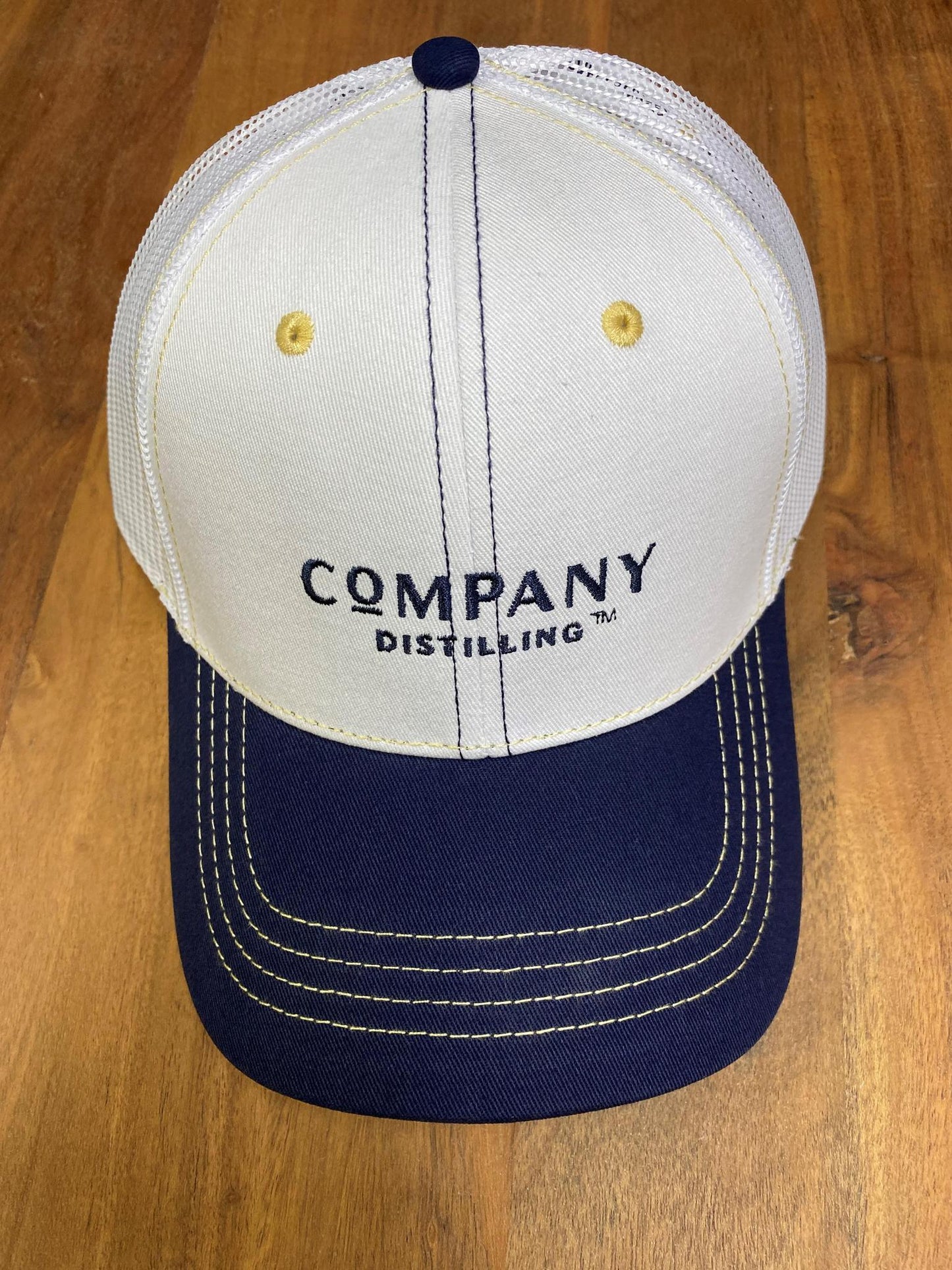 Trucker Hat - White/Navy Bill/Ponytail back w Navy Stacked logo